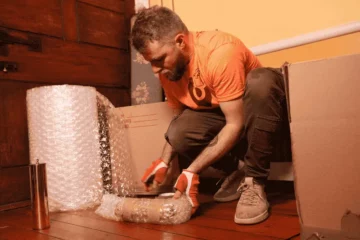 Pick and Pack mover is packing fragile items for secure transportation