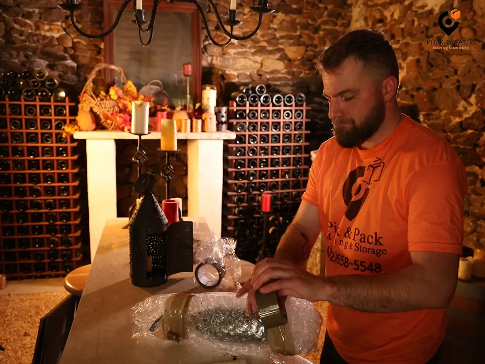 Pick and Pack Moving team preparing wine bottles for transportation