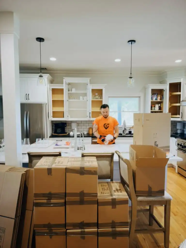 Pick and Pack packer wrapping kitchen items during a Jersey City, NJ move