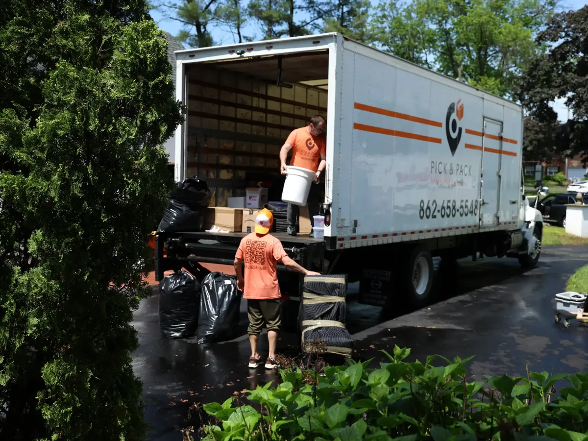 Pick and Pack crew loading the truck at a Ho-Ho-Kus home