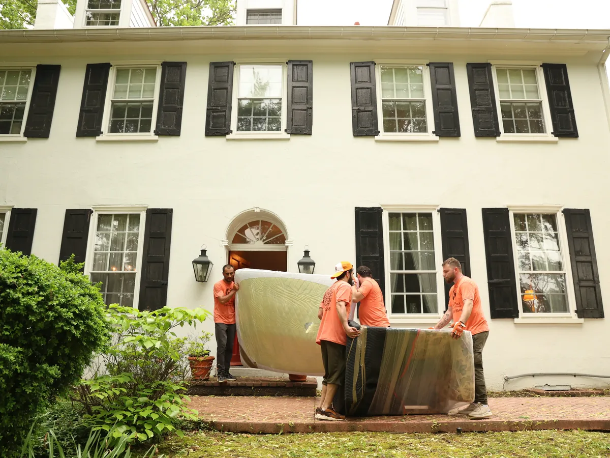 Pick and Pack movers carrying a mattress out of a Ho-Ho-Kus home