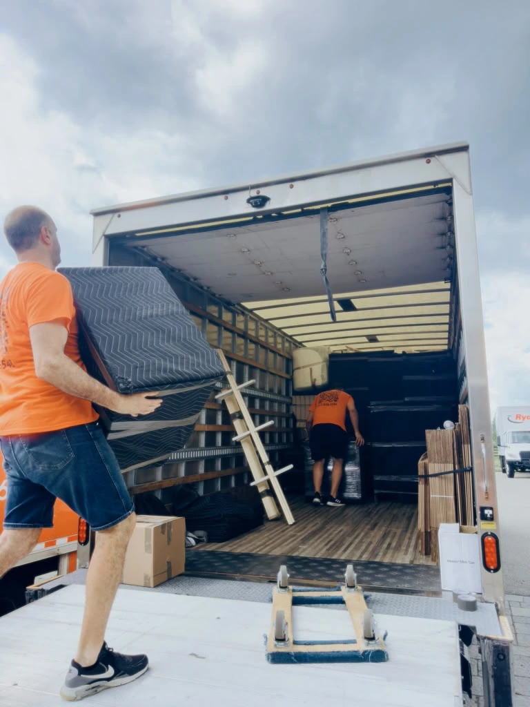 Pick and Pack Moving crew loading apartment furniture into a moving truck