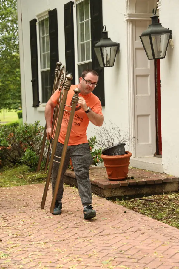 NJ furniture movers from Pick and Pack moving a headboard with care